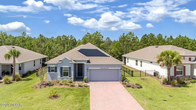 view of front of house featuring a front yard and a garage