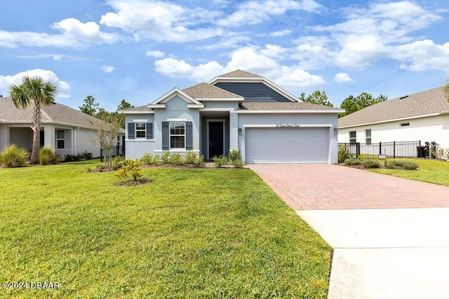 view of front facade featuring a front yard and a garage