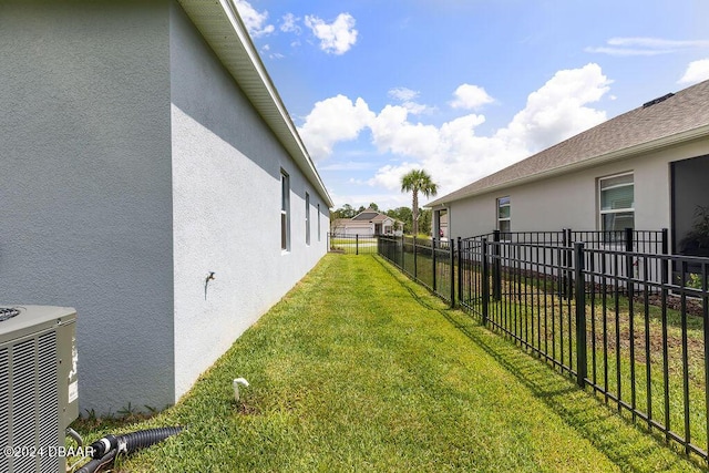 view of yard with central AC