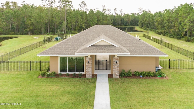 view of front of house featuring a front yard and a rural view