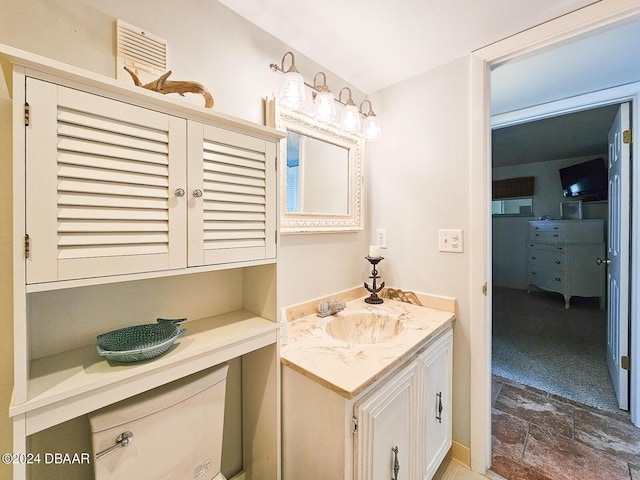 3606 S Peninsula Dr Unit 614, Port Orange, FL 32127 - bathroom featuring stone finish floors and vanity