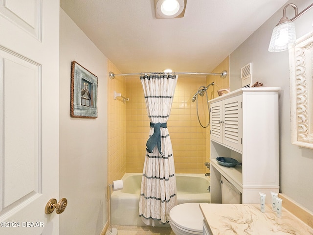 full bathroom with toilet, vanity, and shower / bath combo with shower curtain