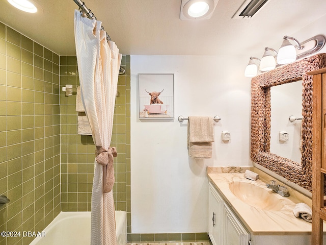 bathroom with vanity and shower / bathtub combination with curtain