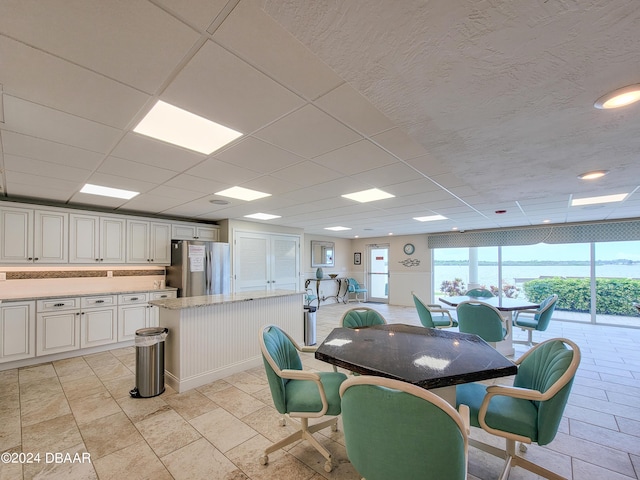 3606 S Peninsula Dr Unit 614, Port Orange, FL 32127 - dining area featuring a drop ceiling