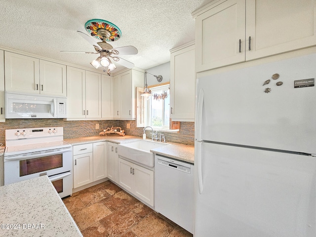 kitchen with sink, tasteful backsplash, ceiling fan, a textured ceiling, and white appliances