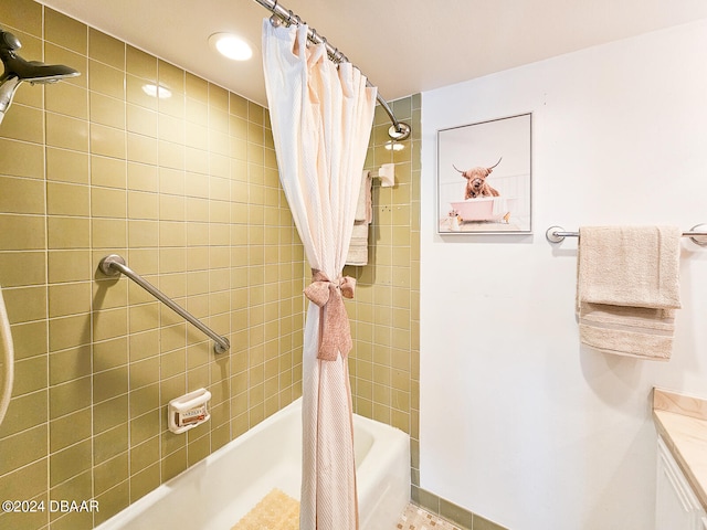 bathroom featuring vanity and shower / bath combo