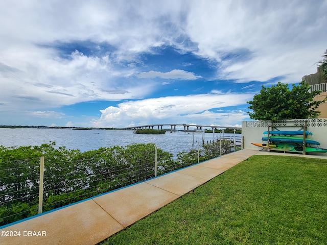 exterior space featuring a water view and a lawn