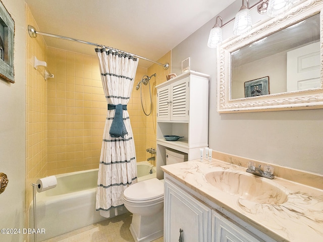 full bathroom with vanity, shower / bath combo, and toilet