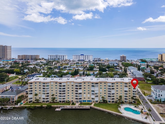 birds eye view of property with a water view