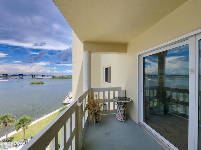 balcony featuring a water view