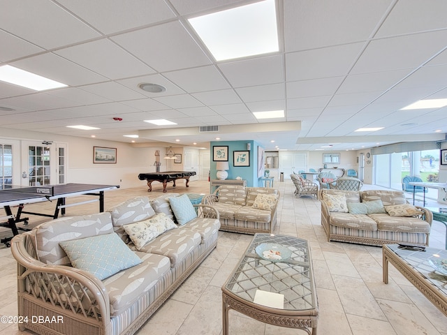 tiled living room with billiards, french doors, and a drop ceiling