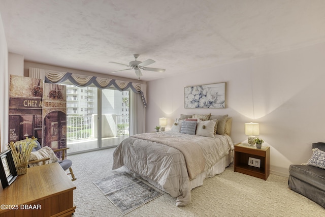 1 John Anderson Dr Unit 317, Ormond Beach, FL 32176 - carpeted bedroom featuring access to exterior and a ceiling fan