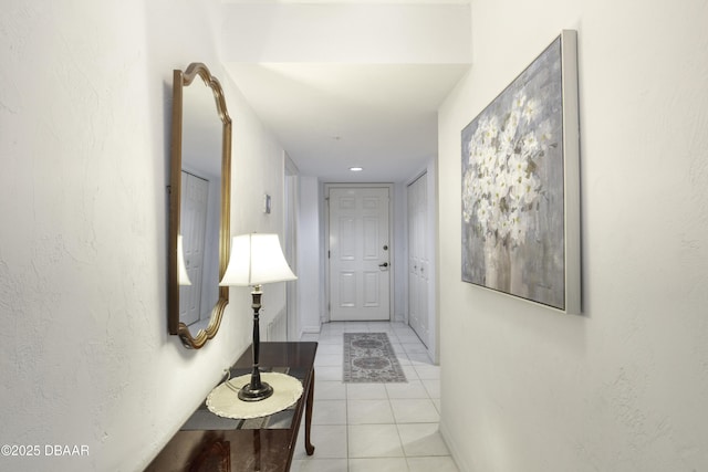 1 John Anderson Dr Unit 317, Ormond Beach, FL 32176 - hallway with light tile patterned flooring