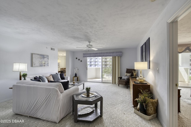 1 John Anderson Dr Unit 317, Ormond Beach, FL 32176 - carpeted living area with a ceiling fan and a textured ceiling