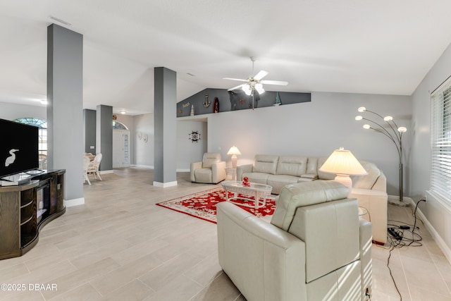 living room with vaulted ceiling, ceiling fan, and light wood-type flooring