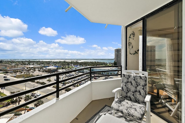 balcony featuring a water view