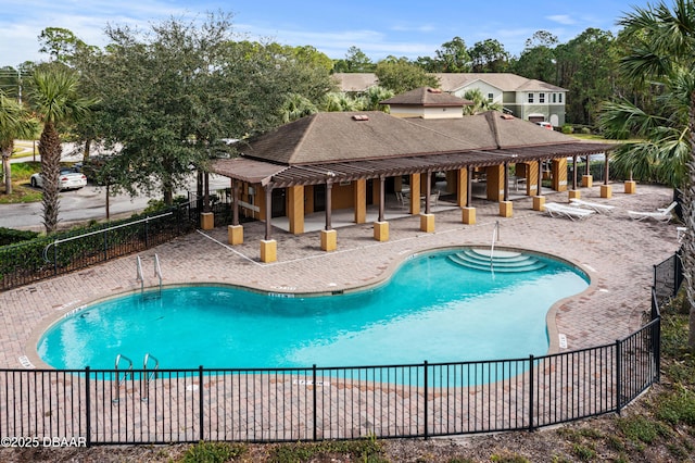 view of swimming pool with a patio area