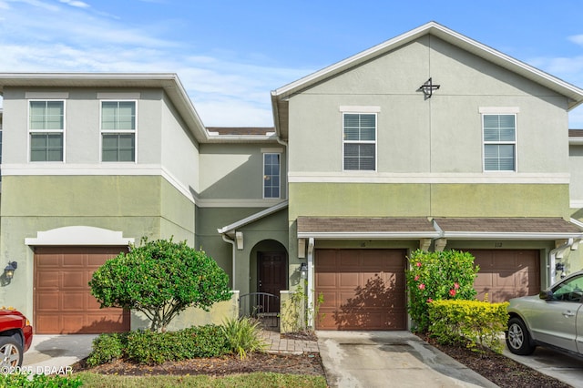 multi unit property featuring a garage