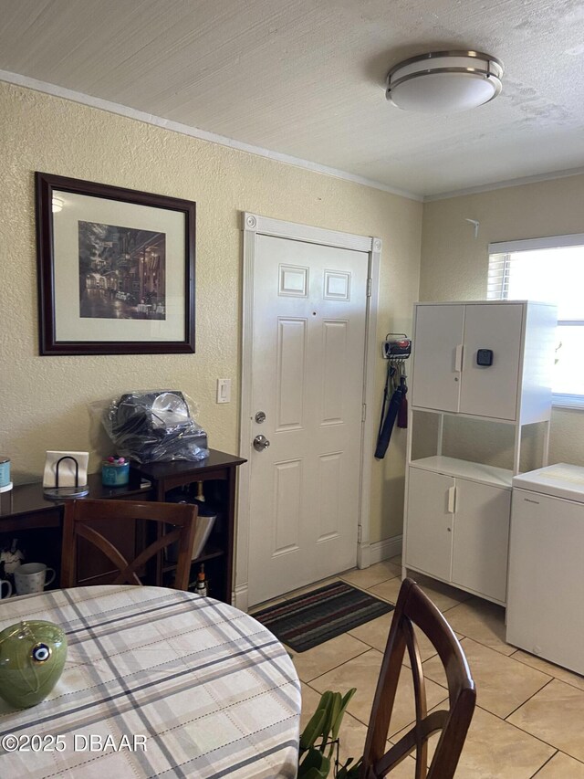 4250 SW 67th Ave Unit 32, Miami, FL 33155 - interior space with light tile patterned flooring, crown molding, and a textured wall