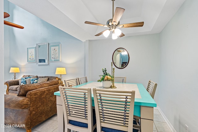 dining area with light tile patterned floors and ceiling fan