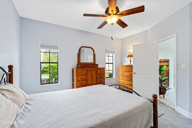 bedroom with light tile patterned flooring and ceiling fan