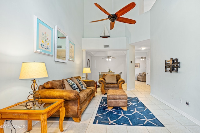 tiled living room with a towering ceiling