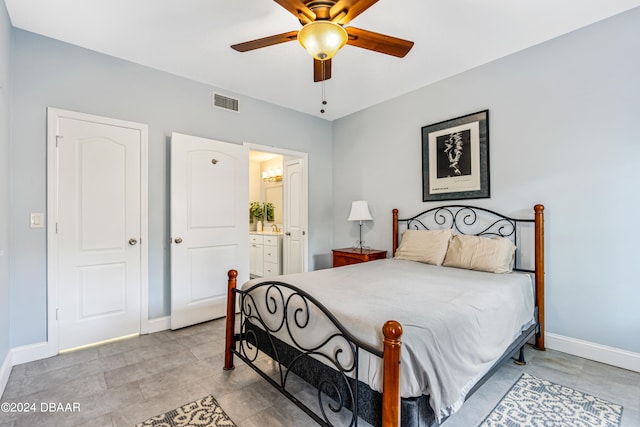 bedroom featuring ensuite bathroom and ceiling fan