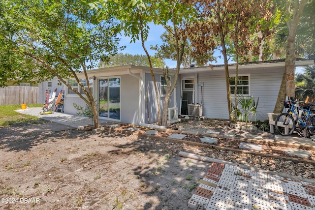 back of property with a patio area