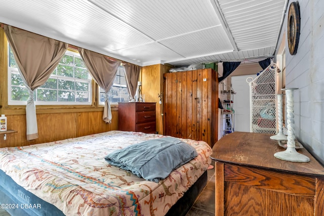 bedroom with wooden walls