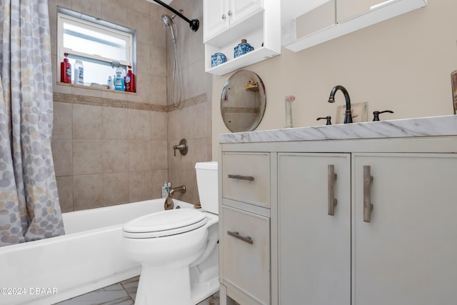 full bathroom featuring vanity, shower / bath combination with curtain, and toilet