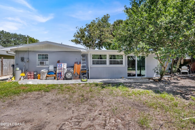 back of house with a patio area