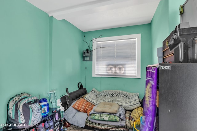 bedroom featuring beam ceiling