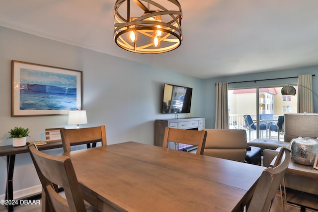 dining area featuring a notable chandelier