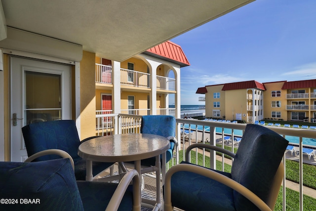 balcony featuring a water view