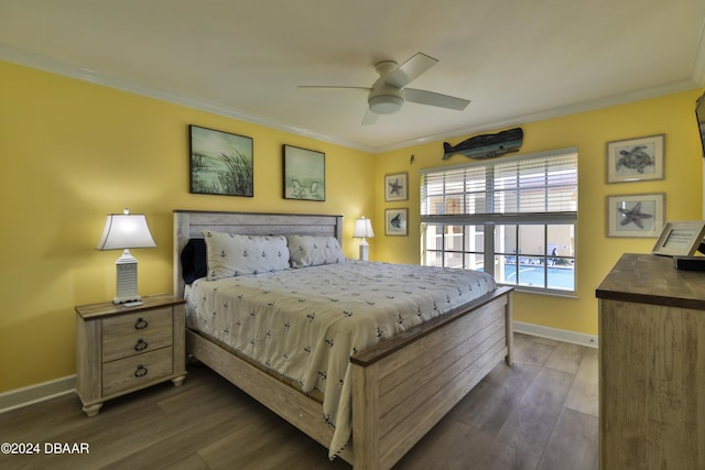 bedroom with dark hardwood / wood-style flooring, ceiling fan, and crown molding