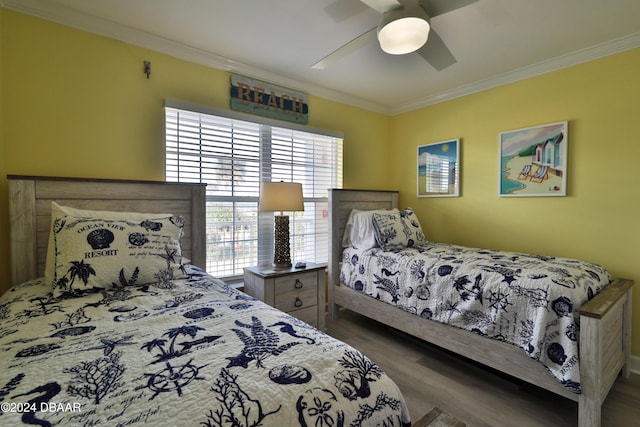 bedroom with ceiling fan, wood-type flooring, and crown molding