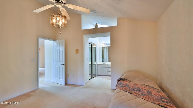 carpeted bedroom featuring baseboards and ensuite bathroom