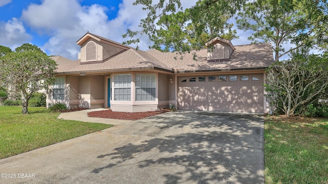 view of front of home featuring a garage, a front lawn, roof with shingles, stucco siding, and driveway
