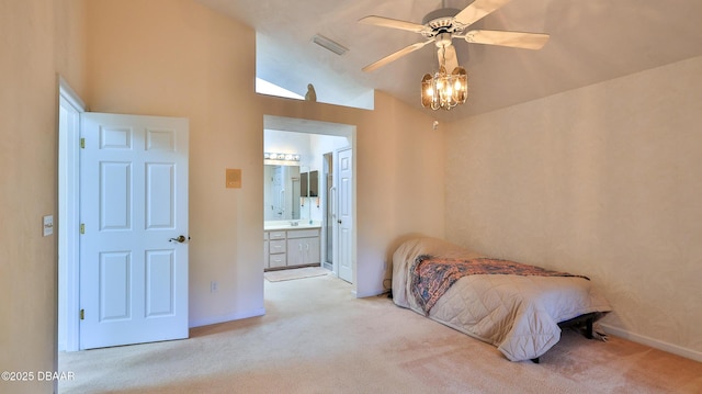 bedroom featuring visible vents, connected bathroom, carpet floors, and vaulted ceiling