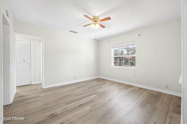 229 S Adams St, Daytona Beach, FL 32117 - empty room featuring light wood-type flooring, a ceiling fan, and baseboards