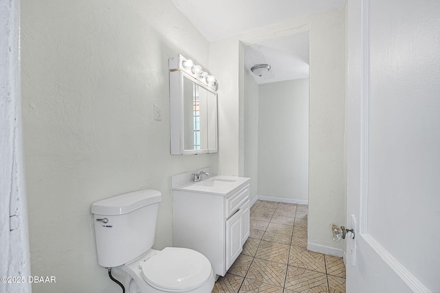 229 S Adams St, Daytona Beach, FL 32117 - bathroom featuring vanity, toilet, and tile patterned floors