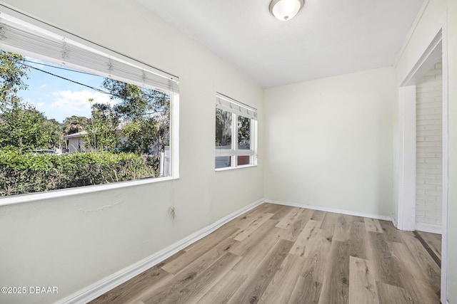 229 S Adams St, Daytona Beach, FL 32117 - unfurnished bedroom featuring wood finished floors and baseboards