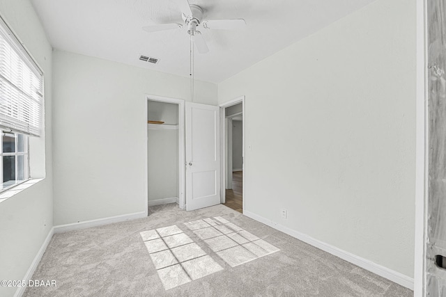 229 S Adams St, Daytona Beach, FL 32117 - unfurnished bedroom featuring carpet, a closet, baseboards, and a ceiling fan