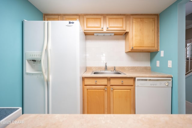 kitchen featuring sink, white appliances, light brown cabinets, and tasteful backsplash