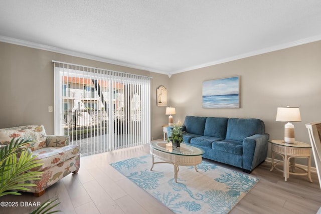 living room featuring a textured ceiling, crown molding, and light hardwood / wood-style floors