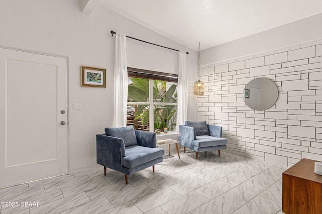 sitting room featuring lofted ceiling