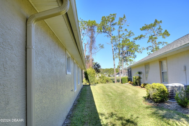 view of yard featuring central AC unit