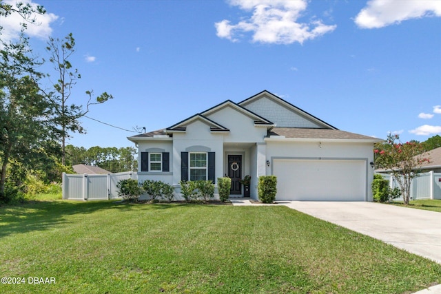 view of front facade featuring a front yard and a garage