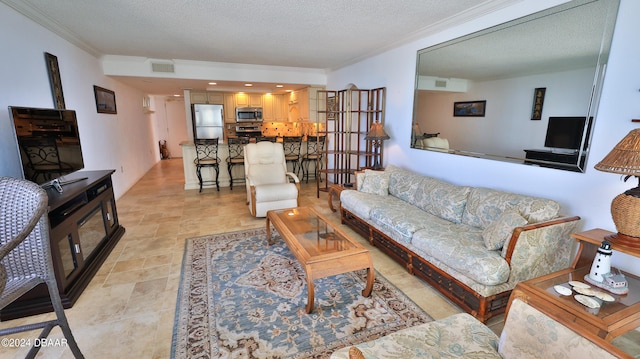 living room with a textured ceiling and ornamental molding