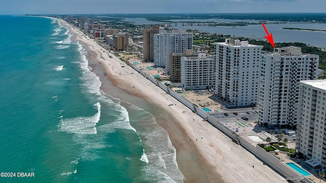 aerial view featuring a view of the beach and a water view